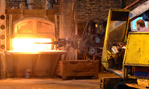 An Image Of A Ring Rolling Machine in a red hot furnace